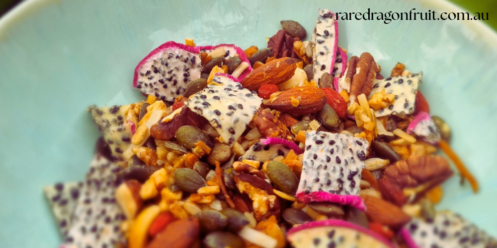 Dragon fruit muesli in a bowl with dehydrated white dragon fruit pieces